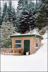 
This cordwood- construction chicken house has an earthen roof and is semi-circular in shape, with the round part recessed into the hill. By Amela and Eric Wettering, Tower, Minn.
